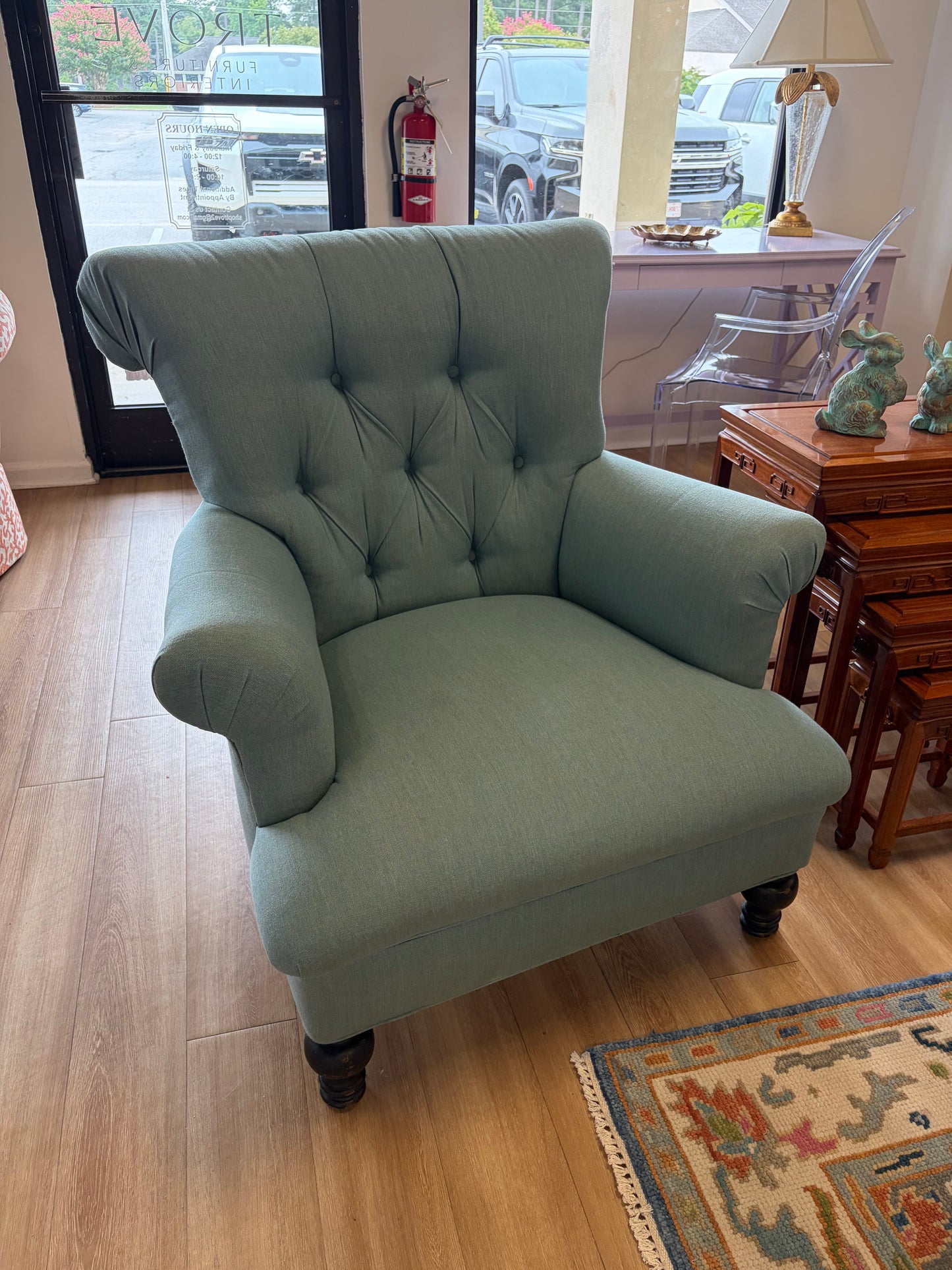 Teal tufted upholstered chair